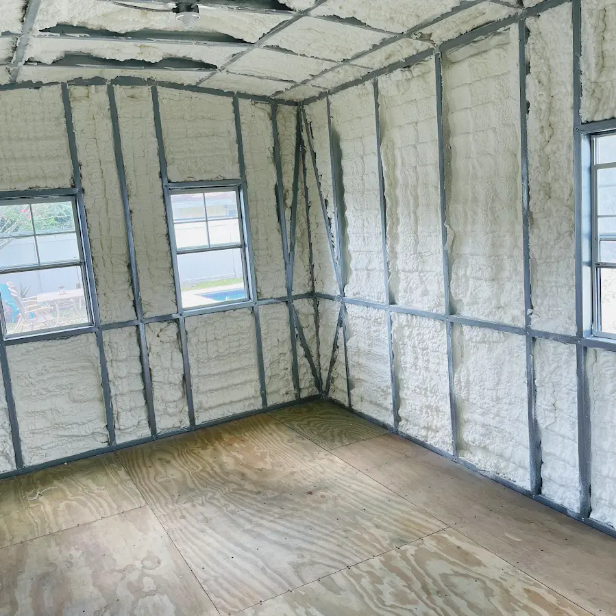 Closed-cell spray foam insulation applied to wall cavities in a residential project in Kaser